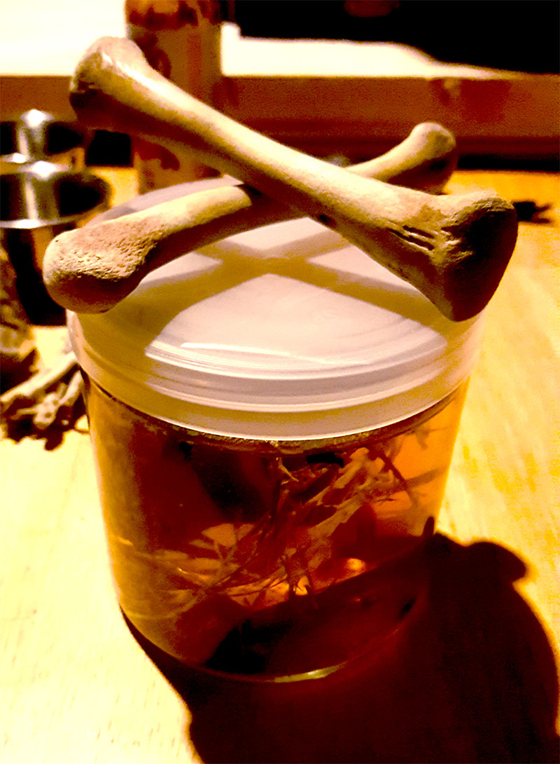Picture of magick spell jar with bones
