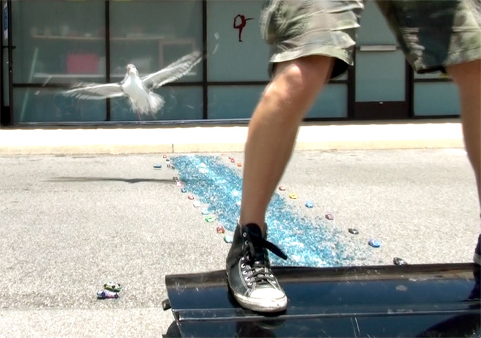 Scotch Wichmann performing a shamanic performance art piece called Crawling Through Glass for Chris Burden, Ventura, CA, 2015